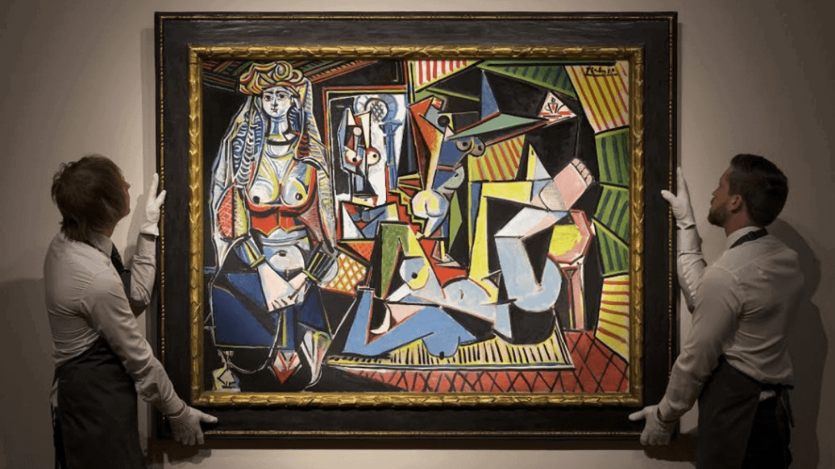 The painting 'Les Femmes d'Alger ("Version O"); by Pablo Picasso is being held at an auction by two men. 