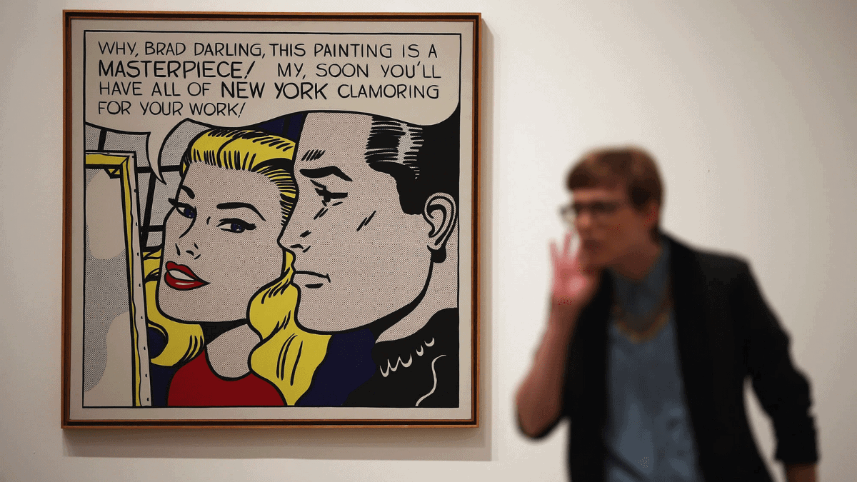 The painting 'Masterpiece' by Roy Lichtenstein hangs on the wall with brown frame. 