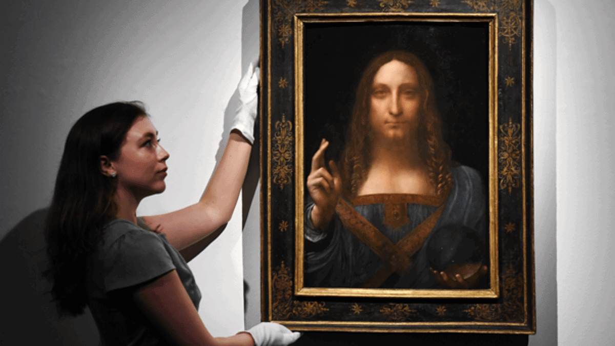 The Most expensive Painting 'Salvator Mundi' being held by girl in the Christie’s auction house. 