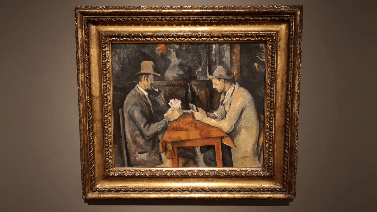 The artwork 'The Card Players' by Paul Cézanne - one of the most expensive paintings displayed with golden and bronze frame.