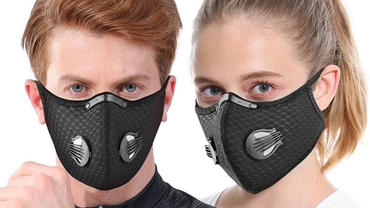 A man and woman wearing black colored antiviral face mask 