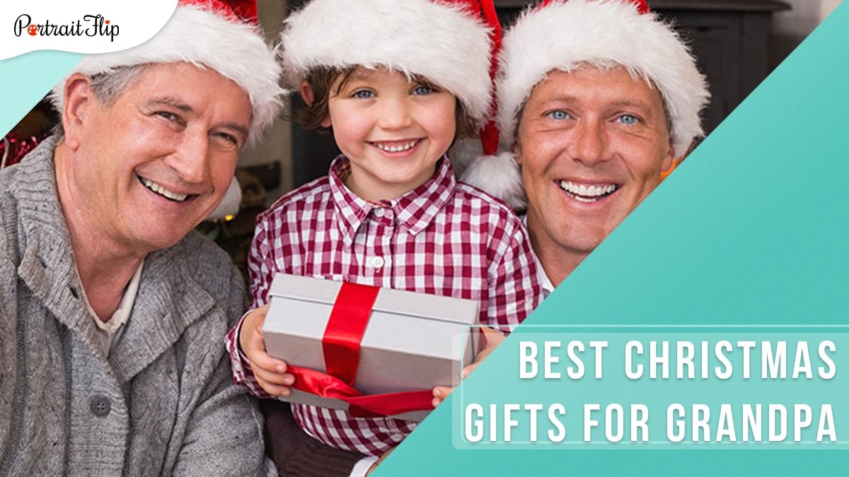 The photo depicts three men; grandpa, grandson and son as they are smiling bright and wearing a red christmas hat. 
The grandchild is holding a Christmas gift for the grandpa. 
The image suggests that the list below includes the best christmas gifts for grandpa.  
