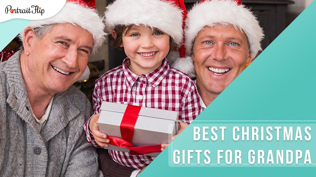The photo depicts three men; grandpa, grandson and son as they are smiling bright and wearing a red christmas hat.
The grandchild is holding a Christmas gift for the grandpa.
The image suggests that the list below includes the best christmas gifts for grandpa.