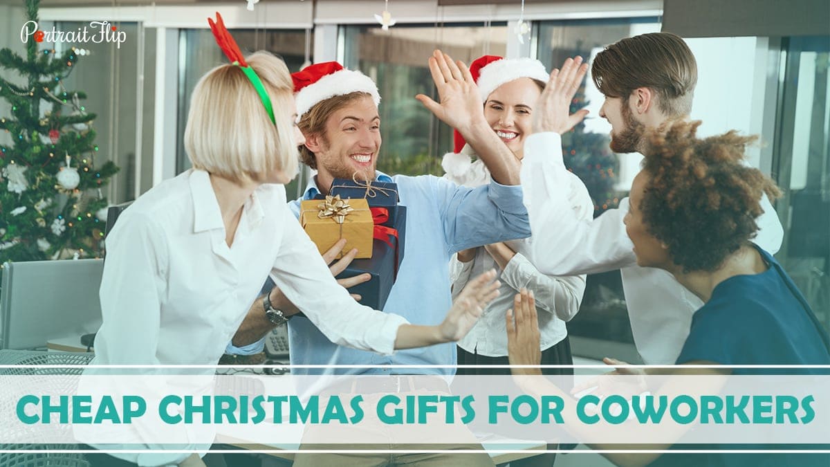 Cheap Christmas Gifts For Coworkers: Office colleagues are opening Christmas gifts and exchanging smiles. 