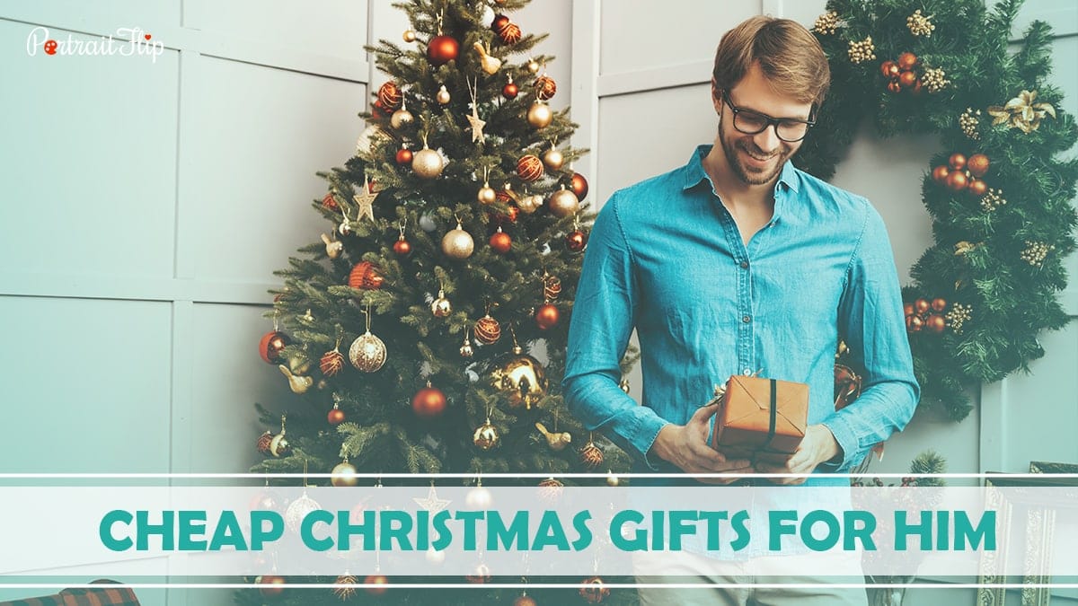 Cheap Christmas Gifts For Him: A man blushing while holding his Christmas gifts.  