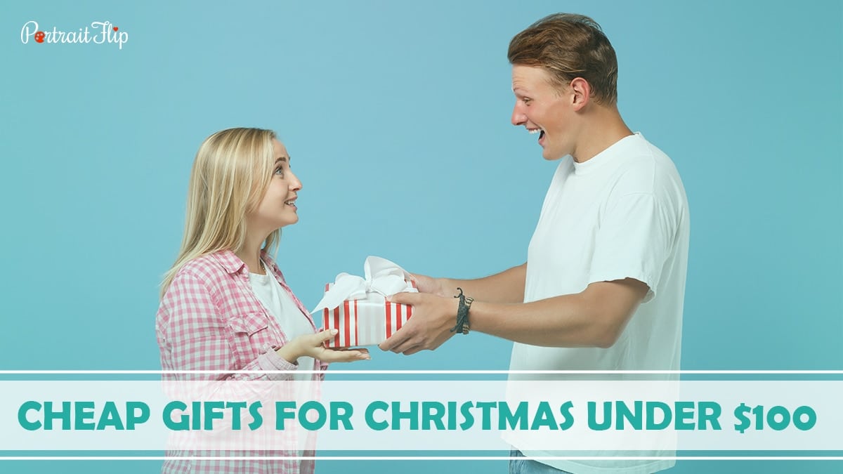 Cheap Gifts For Christmas Under $100: A boy is giving his girlfriend a surprise gift on Christmas. 