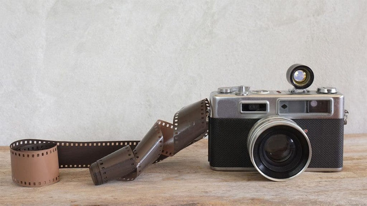 A Film Camera with a film roll on a table