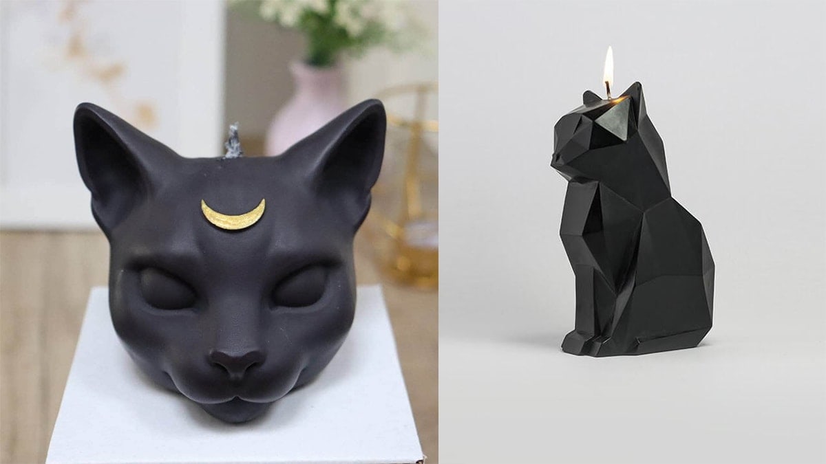 Two funky black cat candles. 