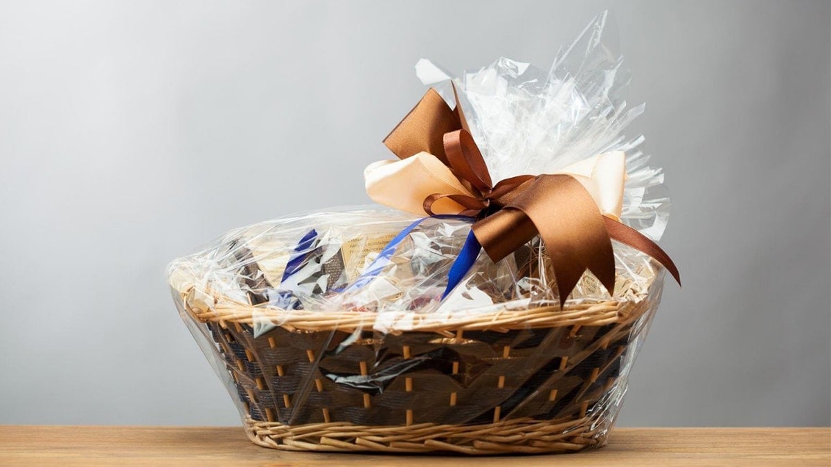 A gift hamper placed on wooden surface. 