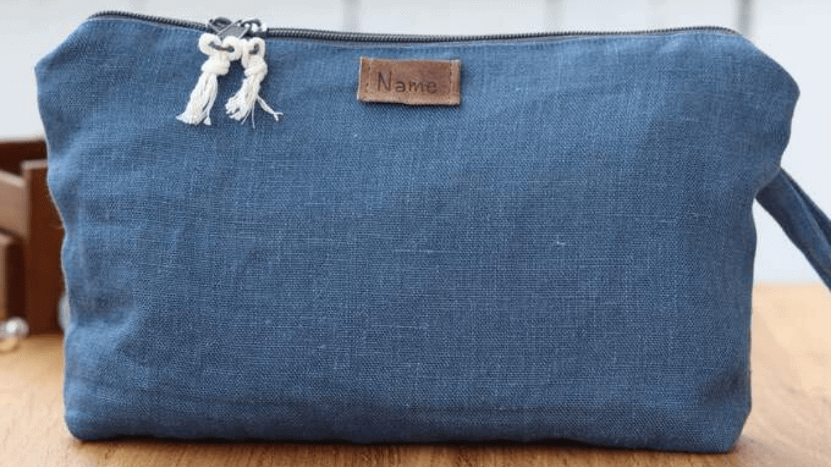 A stylish personalized pouch on the wooden surface. 