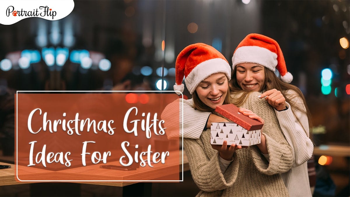 Christmas gifts for sister: a girl giving a christmas gift to her sister. 