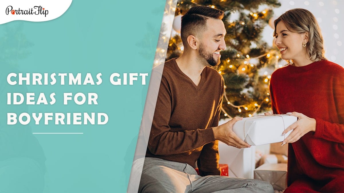 Christmas gift ideas for boyfriend: a woman giving a white christmas present to her boyfriend. 