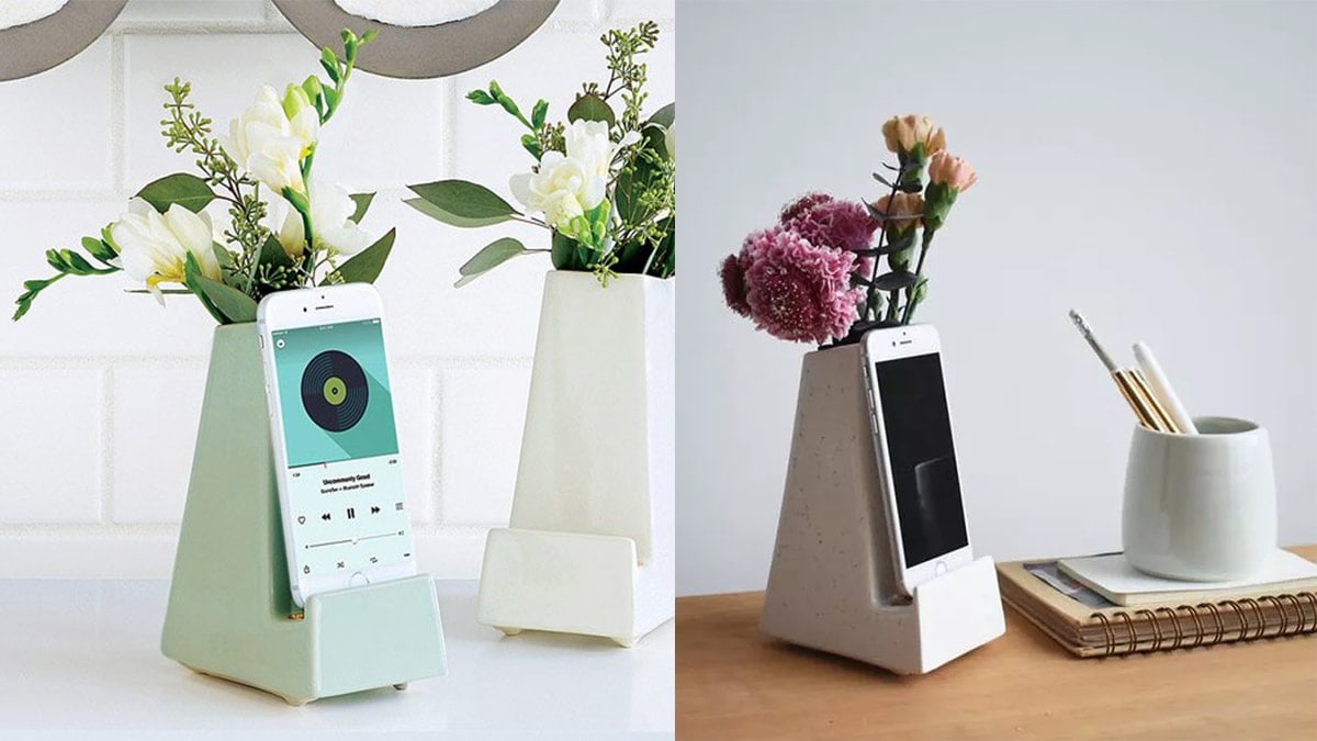 Smartphone vases with phones and beautiful flowers. 