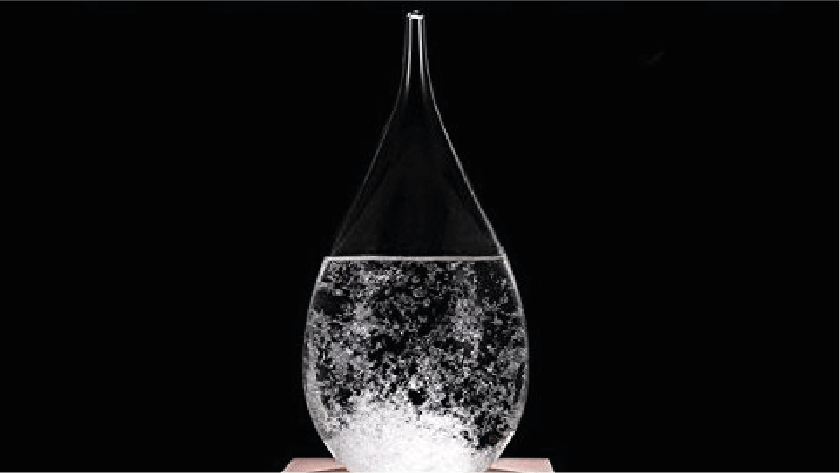 a storm glass against a dark background