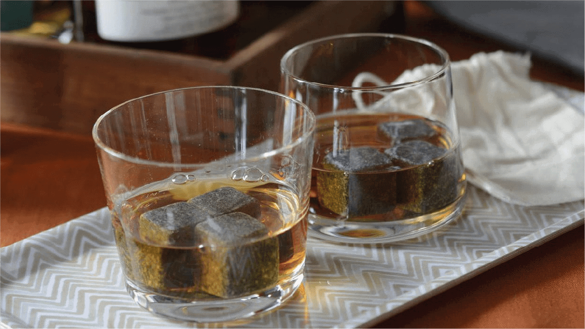 whiskey stones put in two different whiskey glasses