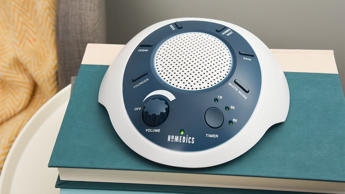 A White Noise Sound Machine kept on the side table 