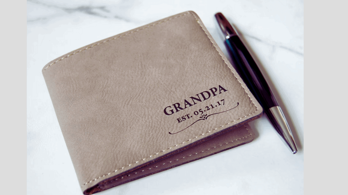 A personalized leather wallet, engraved with the words grandpa and the date he became a grandpa. this sentimental gift is perfect christmas gift idea.