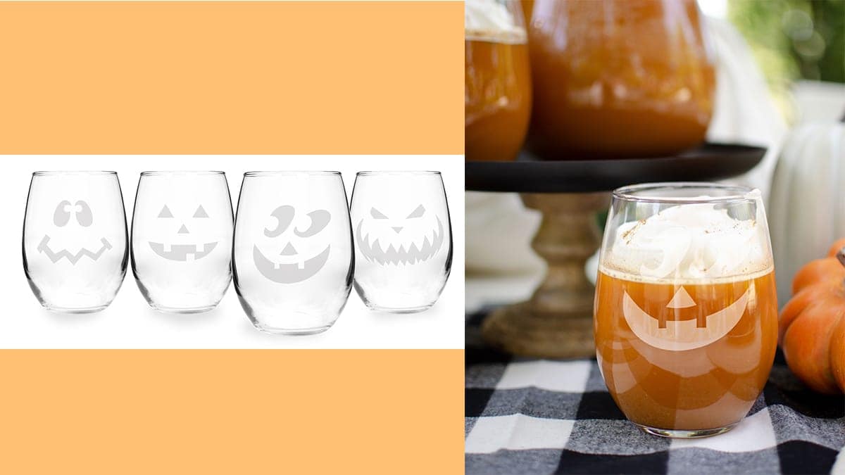 4 Wine glasses with Jack-o-Lantern's different faces engraved on it on the left side. a Halloween themed table setting that has one of the wine glasses filled with a pumpkin drink that can be given as a Halloween gift.