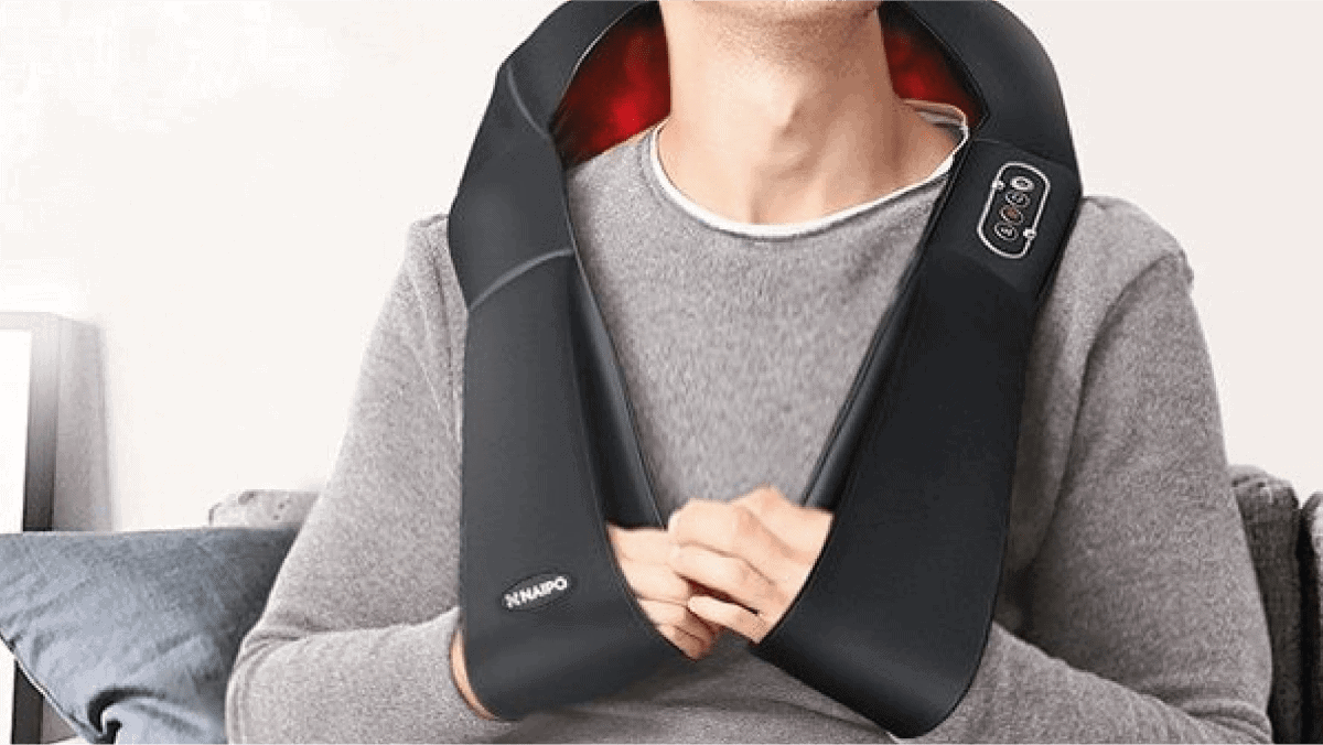 a guy  in grey shirt using the modern neck massager 