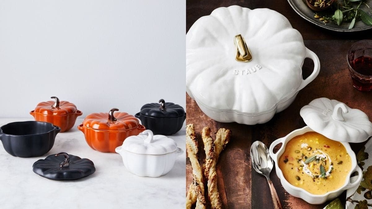 Pumpkin shaped cast iron cocottes in different sizes by Staub. An open cocotte displayed on the table for Halloween dinner with pumpkin soup in it.