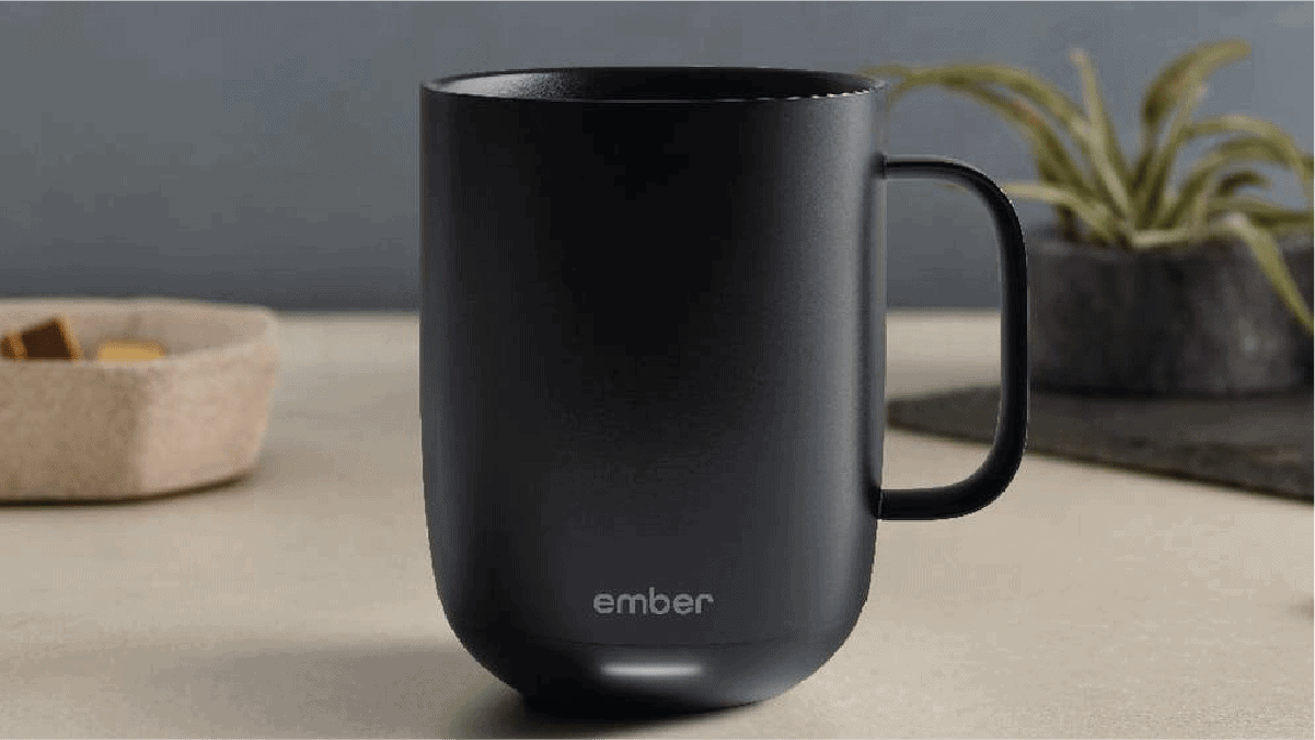 a black smart mug kept on a table. 