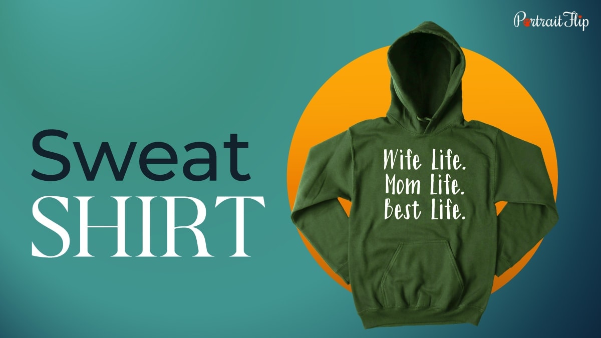 a green sweatshirt with a new mom quote