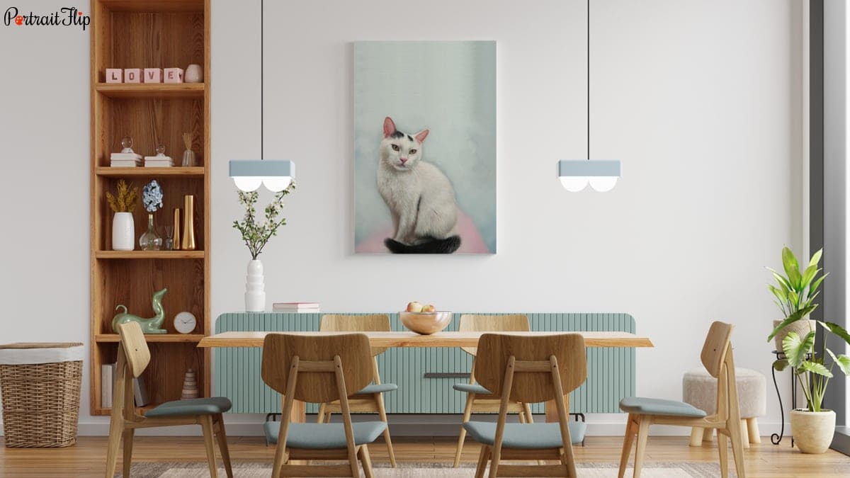 A beautiful white cat portrait made by portraitflip's artist is hung above the dining table. 