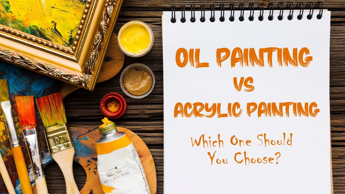 a decorated table with art supplies and a notepad where "Oil Painting Vs Acrylic Painting: Which One Should You Choose?" is written.