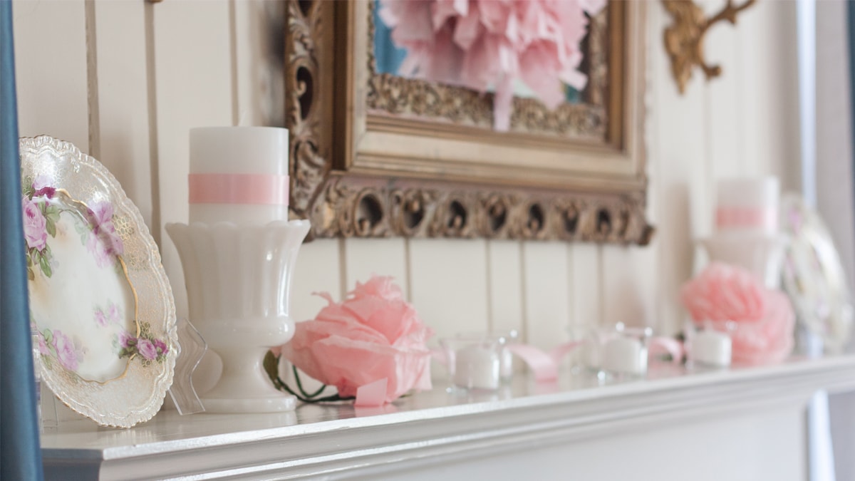 Mantle decorated with white and light pink decor items to give a classy Valentine's day decor look