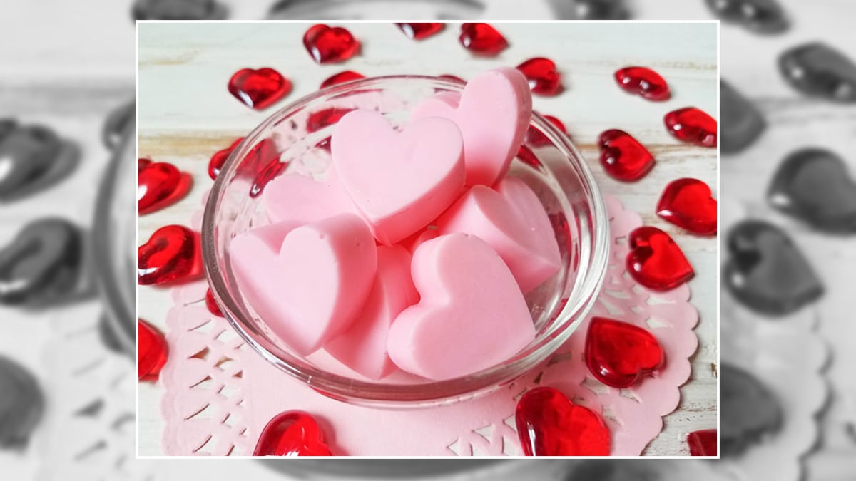 Soft pink heart shaped soaps in a bowl
