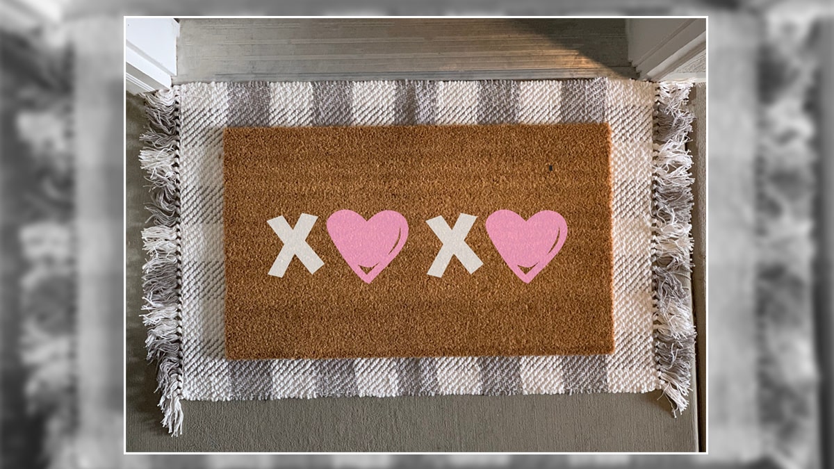 a XoXO doormat with O replaced with hearts is at the door. 