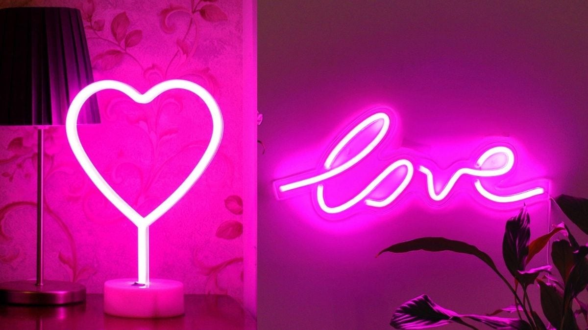 On the left is a heart shaped neon light glowing in pink. On the right is a pink neon sign glowing that reads "Love"