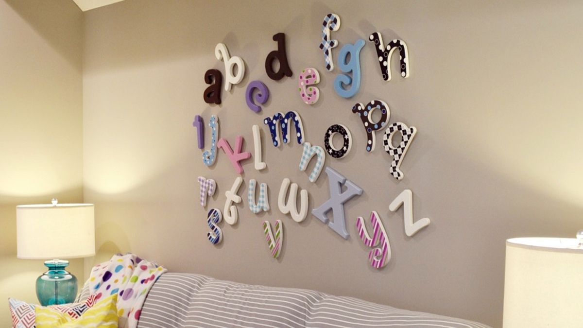 3d alphabets placed on the wall of a girl's bedroom was a bedroom wall decor idea.