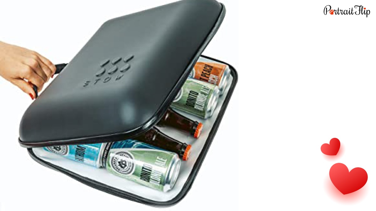 A black colored beer cooler briefcase with beer can and bottles in it. 