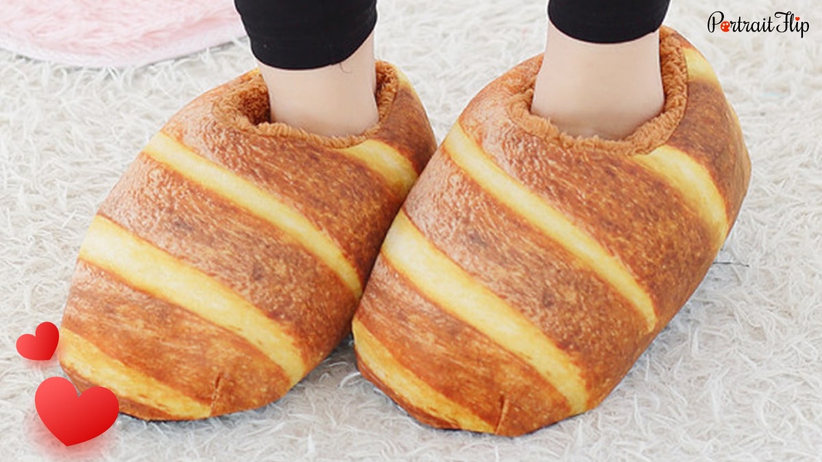 a closeup shot of a woman wearing Bread slippers 