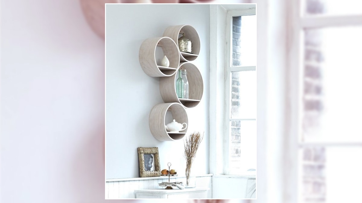 shipping tubes displayed on a bedroom wall as a shelf and a wall décor.