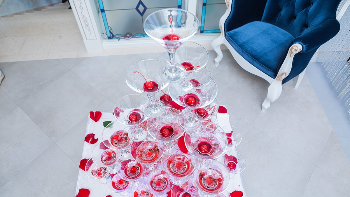 A champagne tower decorated with rose petals for valentine's day