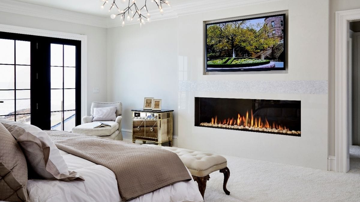 a men's bedroom wall decorated with an electric fireplace.