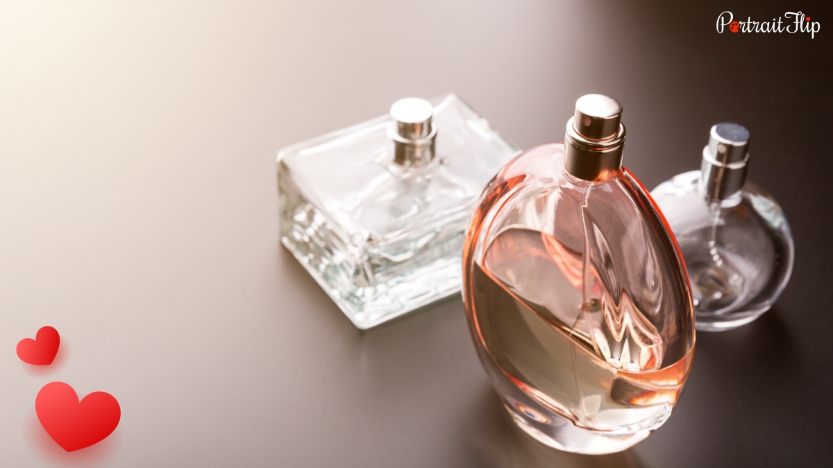3 bottles of men's perfume kept on a table for photogenic purpose. 