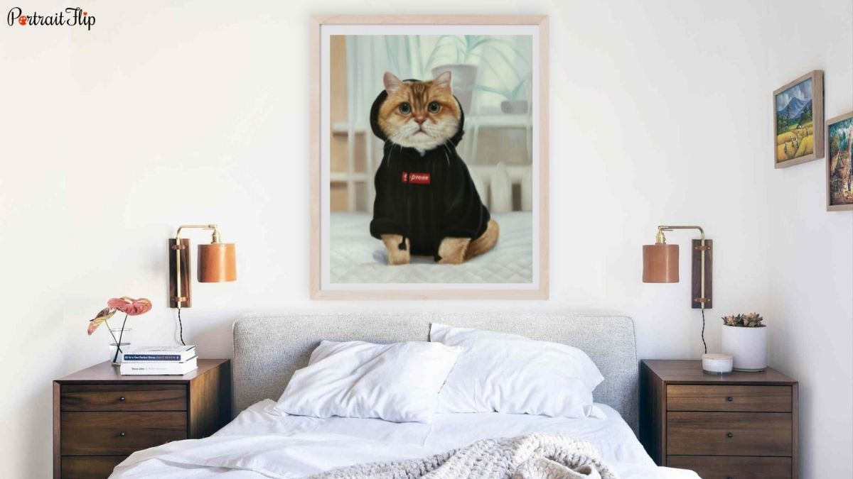 a framed oversized handmade pet portrait by PortraitFlip hung above a bed as one of the ideas for bedroom wall décor.