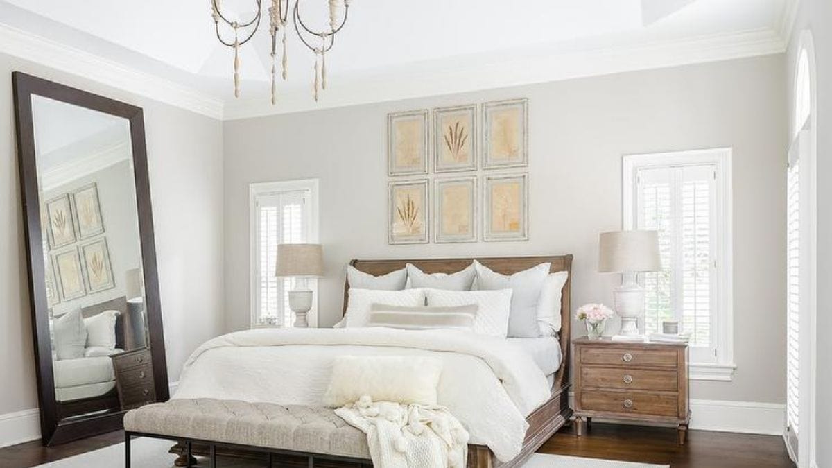 a vintage themed bedroom that has a huge leaning mirror on the wall as one of the ideas for bedroom wall décor.