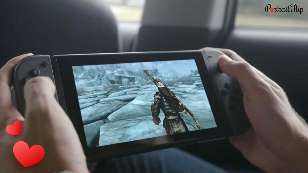 a guy playing a game on Nintendo Switch