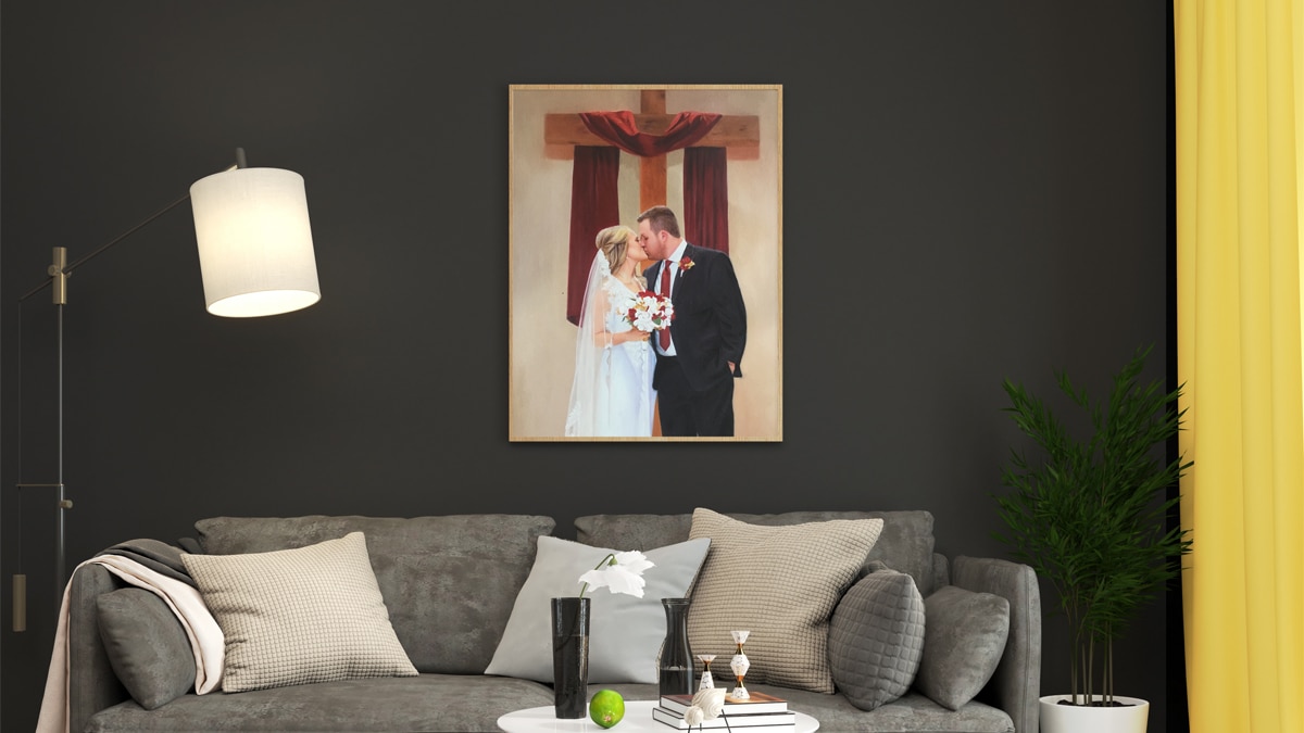A beautiful interior wall decorated with one of PortraitFlip's customer's kiss portrait of a couple kissing in a chapel in front of a huge cross.