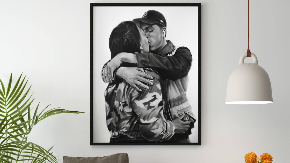A beautiful interior wall decorated with one of PortraitFlip's customer's kiss portrait of a couple kissing each other with passion.