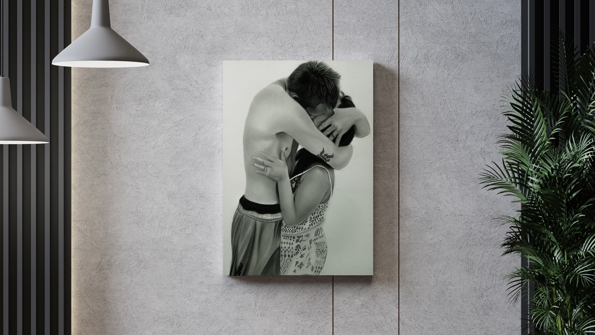 A beautiful interior wall decorated with one of PortraitFlip's customer's kiss portrait of a couple embracing each other with a kiss.