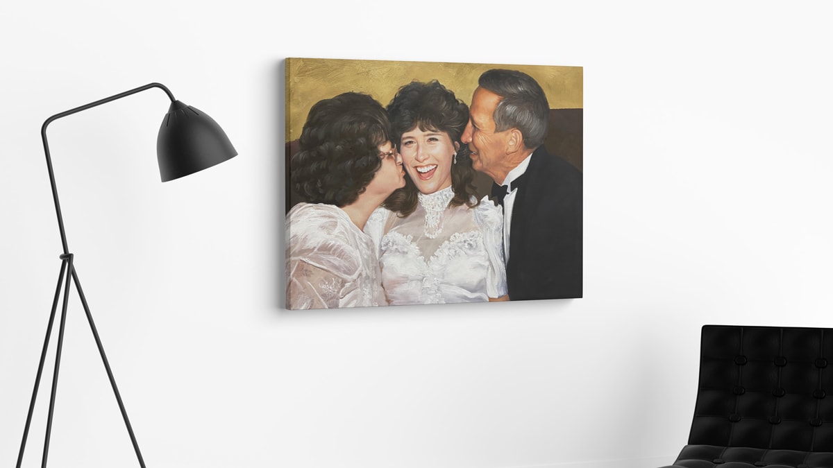 A beautiful interior wall decorated with one of PortraitFlip's customer's kiss portrait of parents kissing their daughter on her wedding day.