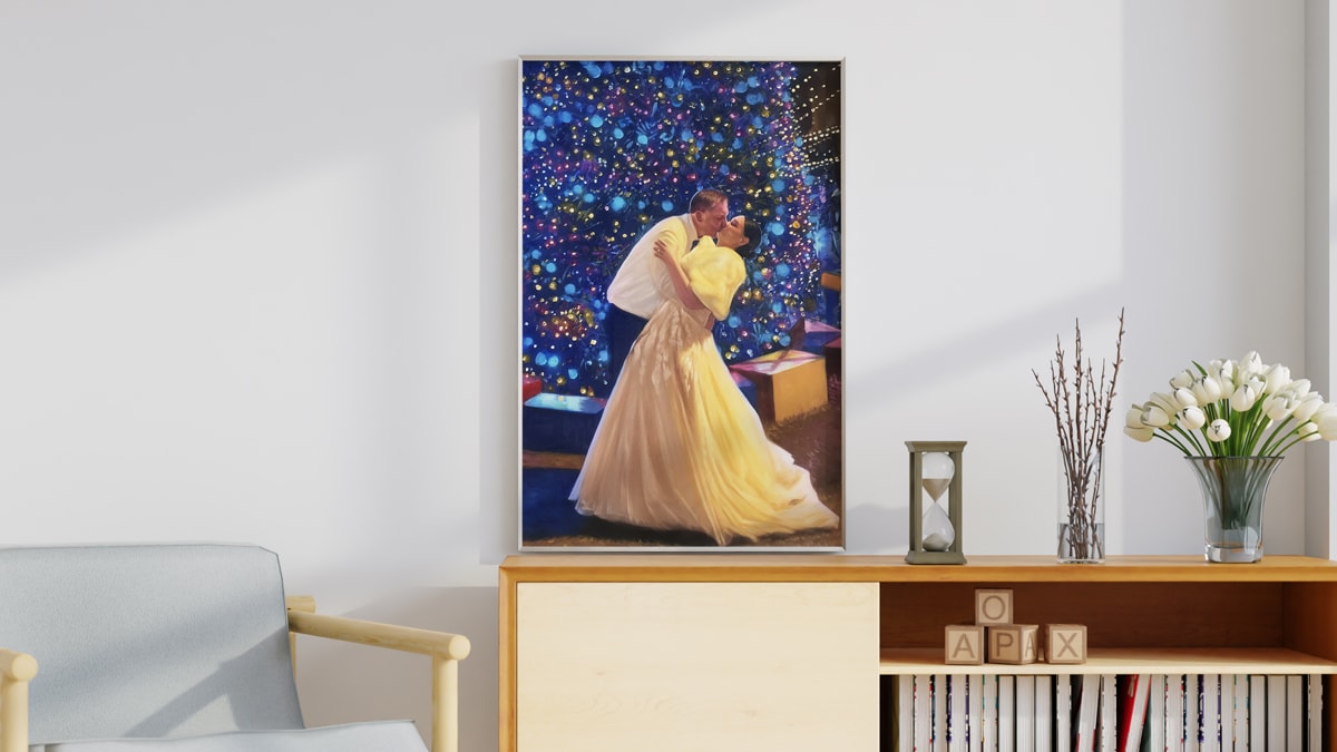 A beautiful interior wall decorated with one of PortraitFlip's customer's kiss portrait of a couple kissing each other on their wedding day Infront of a beautifully decorated Christmas tree.