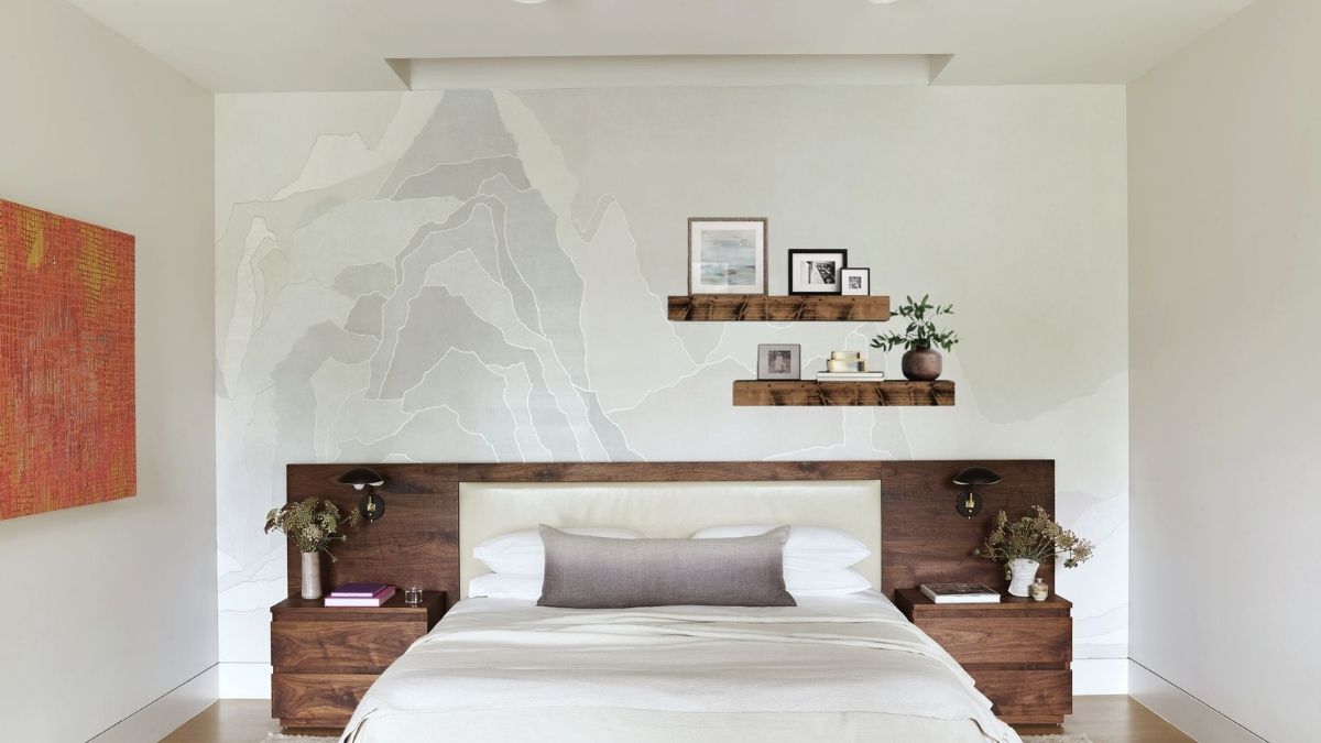 shelves made from salvaged wood are displayed on a bedroom wall.
