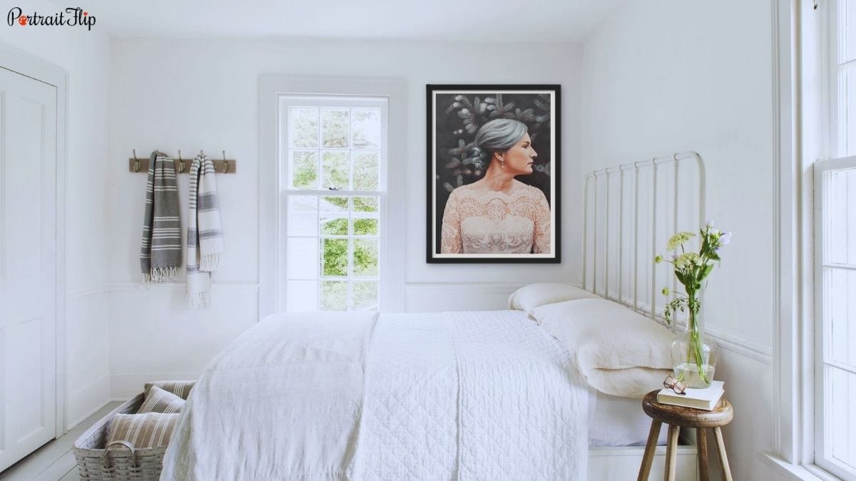 A beautiful and cozy bedroom wall decorated with a custom handmade black and white painting by PortraitFlip as one of the most creative ideas for bedroom wall décor.