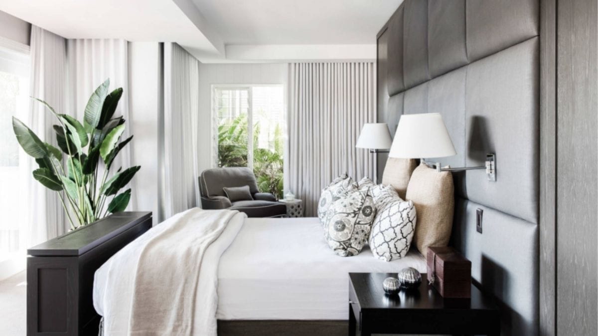 an upholstered black wall shown as an idea for bedroom wall décor.
